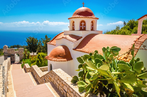 Typical Greek church with red roof, Greece