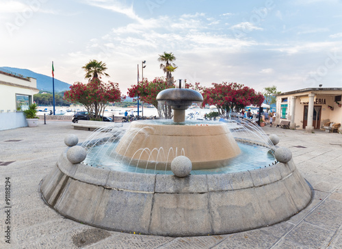 fountain at sunset on the sea