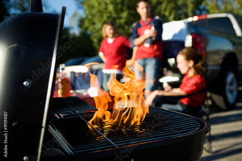 Tailgating: Flames Rise As Charcoal Is Prepped For Cooking