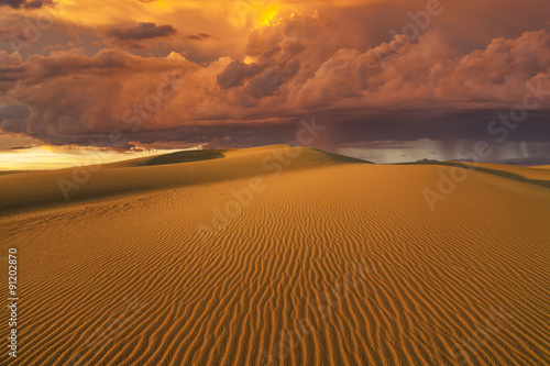 Amazing fiery rain clouds over the Gobi desert. Mongolia.