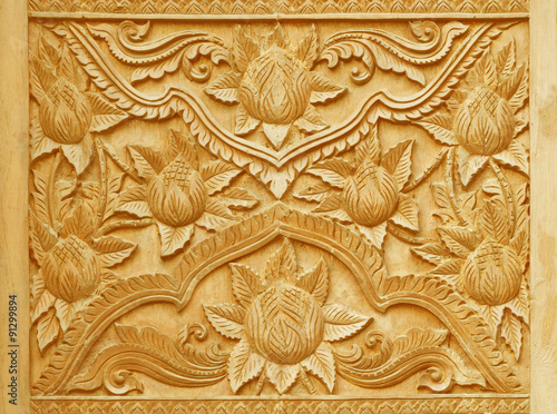 Flower carved on wood panels.