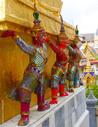 Demons supporting golden chedis, wat phra kaew, bangkok, thailand
