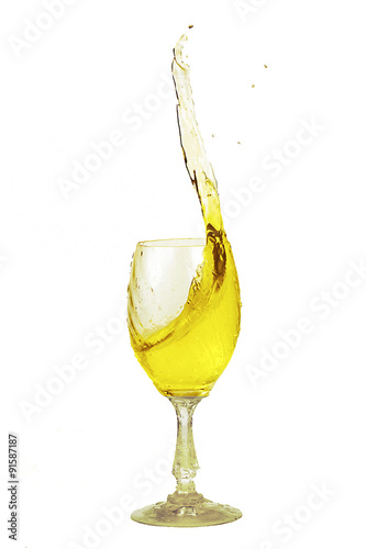 Yellow drink sloped in a glass