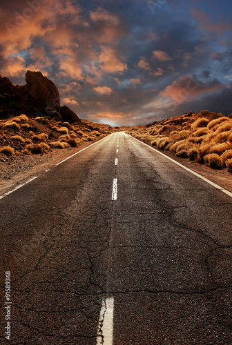 Road through sunset desert