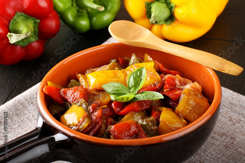 Peperonata: peppers cut into slices and baked in a pan