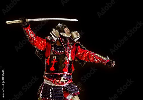Samurai in ancient armor with a sword attack