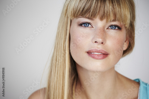 Blue eyed blond woman in portrait