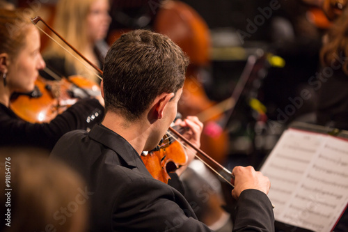 Symphony orchestra performing.