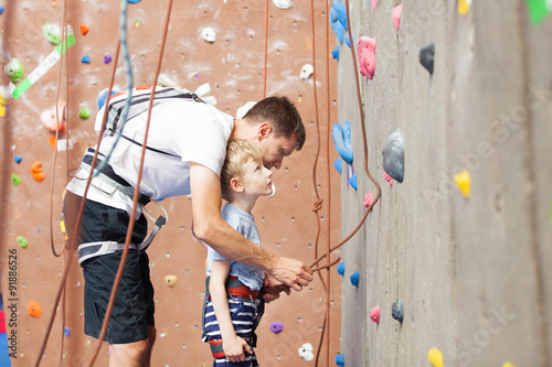 boy rock climbing