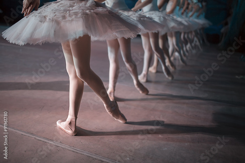 Dancers in white tutu synchronized dancing