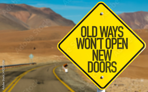 Old Ways Wont Open New Doors sign on desert road