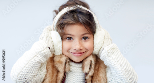 happy little girl wearing earmuffs