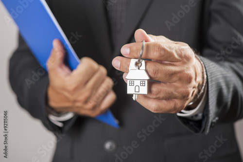 Hand with a house key