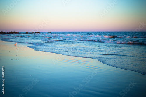 Beautiful ocean shoreline at beach at sunset