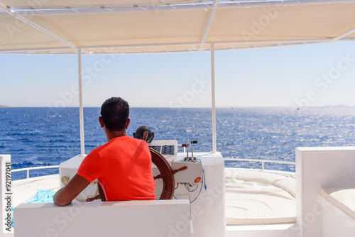 Captain or helmsman on a yacht