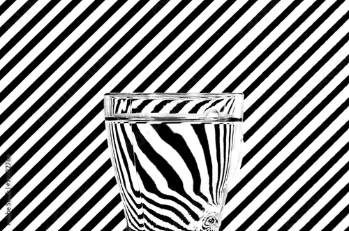 Abstract refraction of black and white diagonals in a glass of w