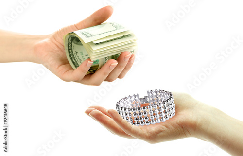 Jewelry and money on hands- pawnshop concept