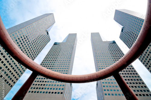 Modern hi rise buildings architecture against blue sky at business center, Singapore