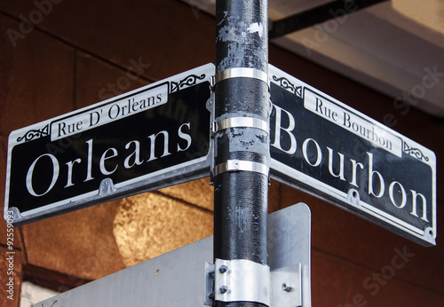 Street signs for Rue D' Orleans and Rue Bourbon in New Orleans, Louisiana