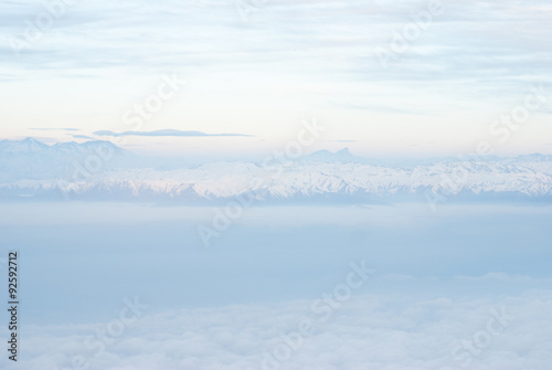 Above the clouds aerial view of snowcapped andes mountains