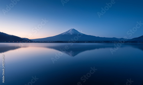 mountain Fuji at dawn with peaceful lake reflection