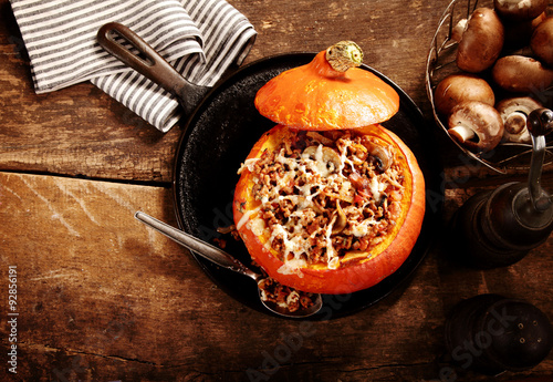 Tasty autumn stuffed pumpkin with mushrooms