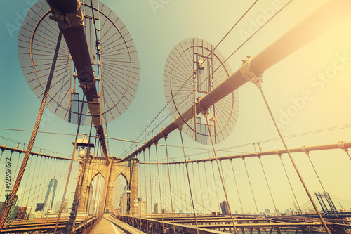 Vintage toned fisheye lens picture of Brooklyn Bridge, NYC, USA.