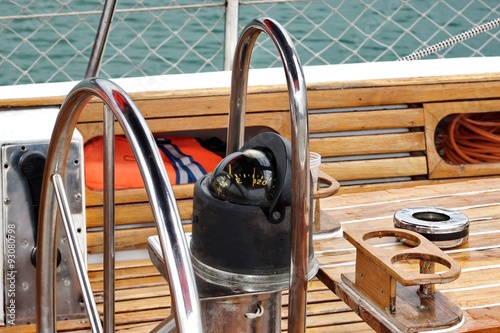 Metal Large Steering Wheel And Compass On The Sailboat