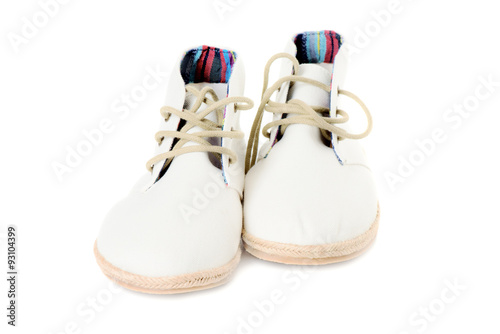 Pair of trendy canvas shoes isolated on white front