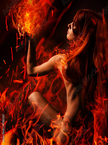 Red hair naked girl and fire