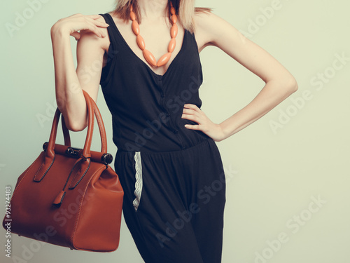 Elegant fashion woman with leather handbag