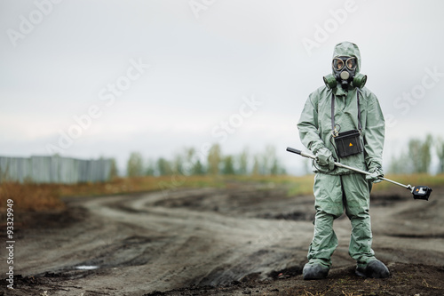 Scientist (radiation supervisor) in protective clothing and gas