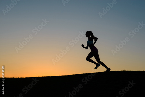 Girl running in the morning on the nature.