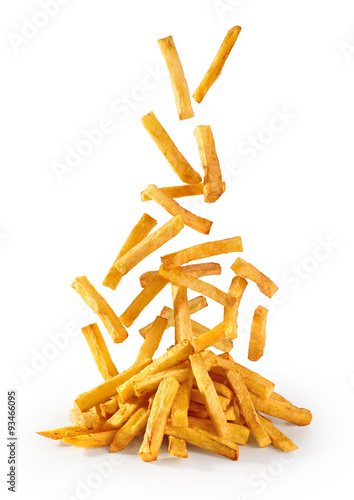 Flying fried potatoes isolated on white background. French fries