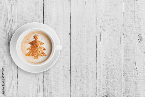 coffee mug with christmas tree shape on white wood table
