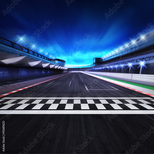 finish line on the racetrack in motion blur with stadium and spotlights