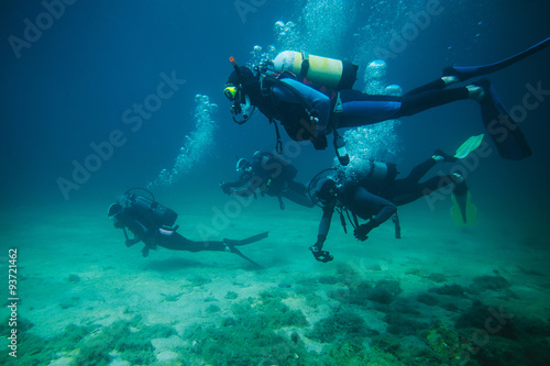 Four divers underwater 