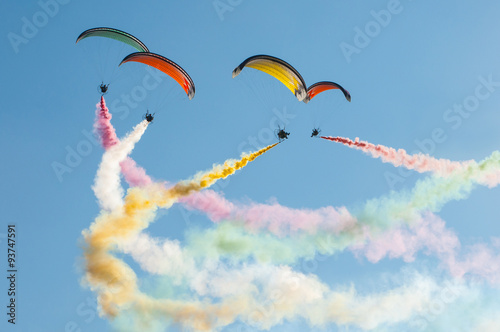 paraglinding performance of paramotors with multicolor smoke.
