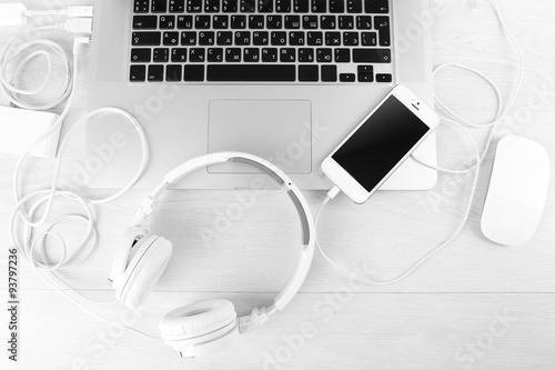 Computer peripherals and laptop accessories on white wooden background