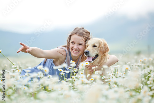 Beautiful girl with dog friend in a wild nature 