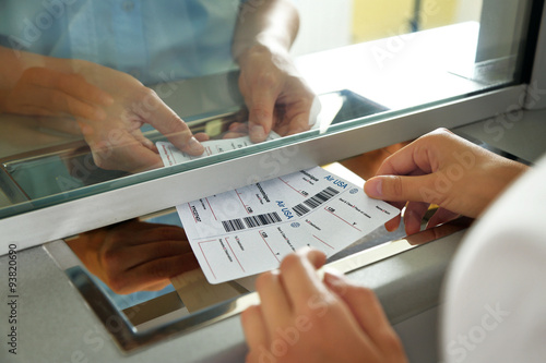 Woman buying tickets at box office