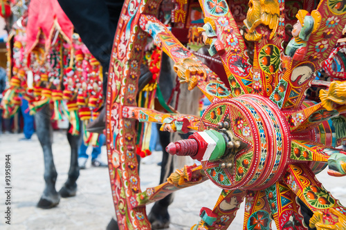 Close up view of a colorful wheel of a typical sicilian cart
