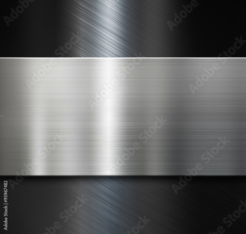metal plate over black brushed metallic background