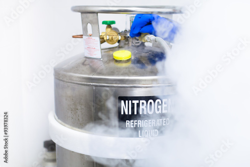 Huge tank of nitrogen half covered by fume caused by evaporation