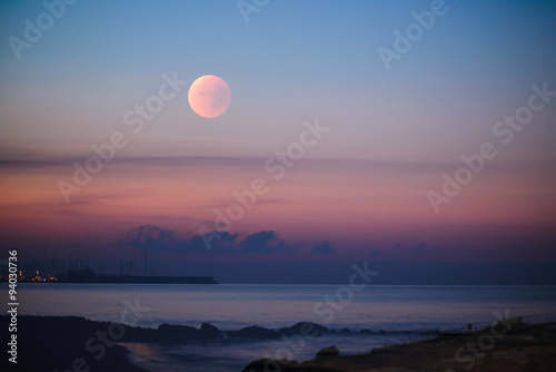 Sunset moon rose over the Mediterranean Sea. Limassol. Cyprus.