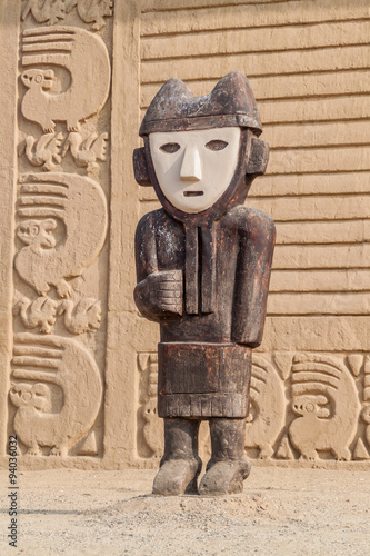 Wooden statue at archeological site Chan Chan in Trujillo, Peru