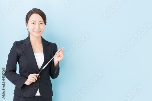 portrait of asian businesswoman on blue background