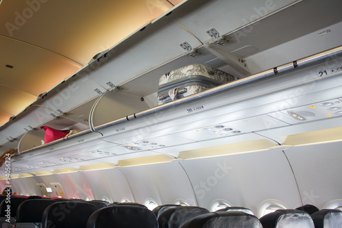 cabin baggage overhead on the airplane