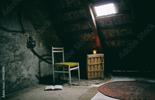 STill Life of Chair and Book with Candle Light and Window Light in Old Attic Room