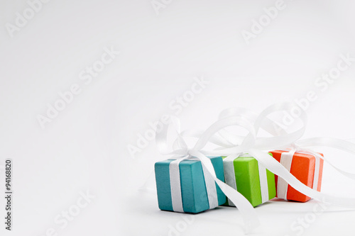 Gifts for Christmas or a birthday - three colourful packages